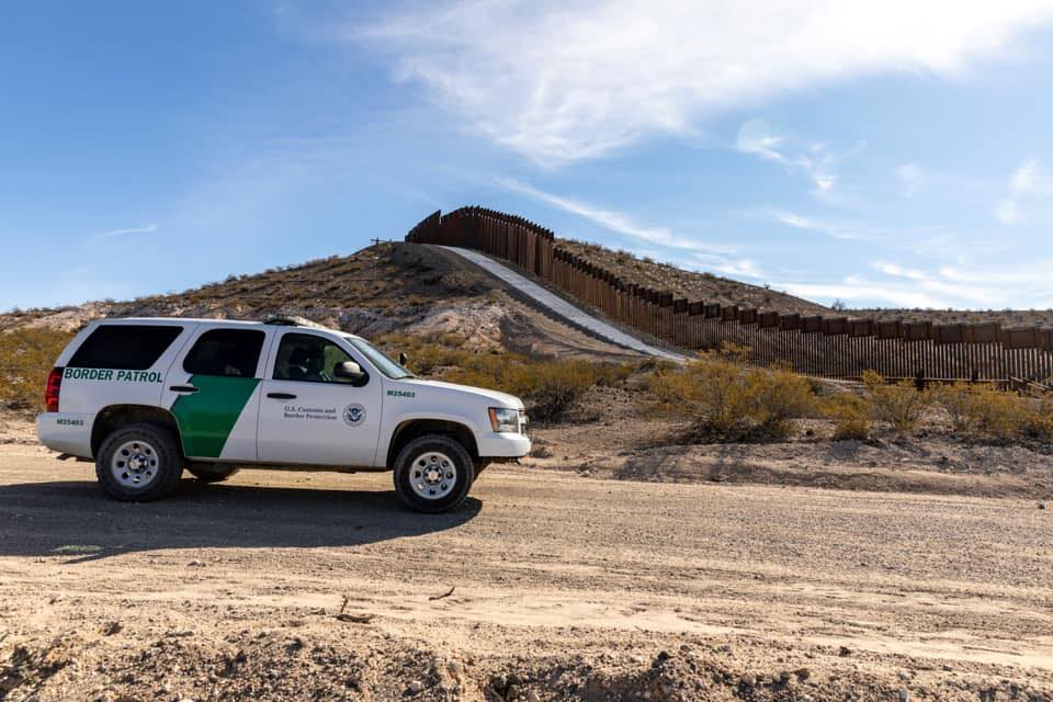 Border Patrol USBP miscellaneous modern vehicle on dirt road near fence