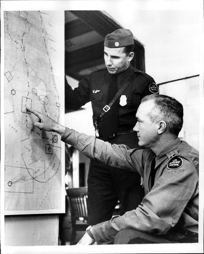 Miscellaneous Historical history old an inspector and a pilot looking at a map