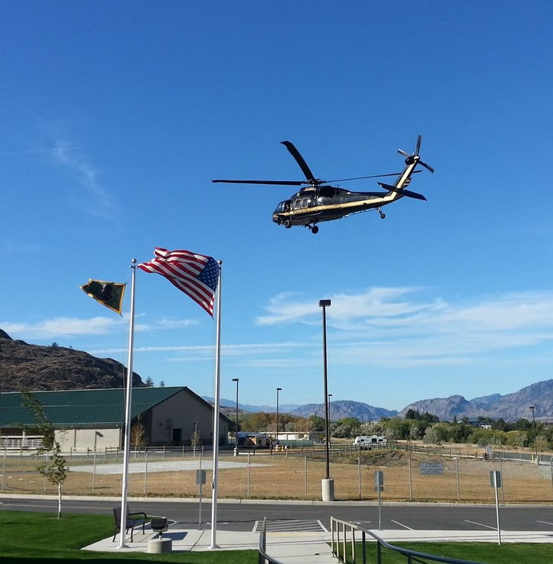 Border Patrol USBP miscellaneous modern helicopter flying over flags 