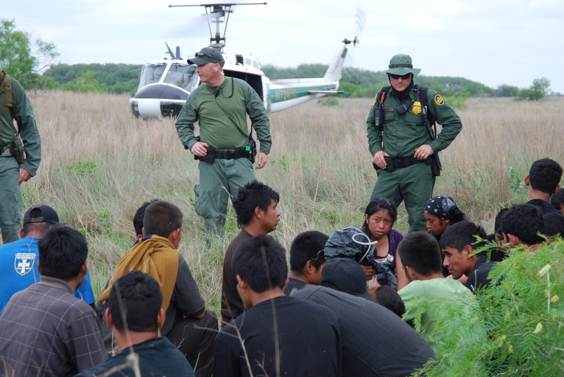 Border Patrol USBP miscellaneous modern helicopter agents arresting a group of aliens