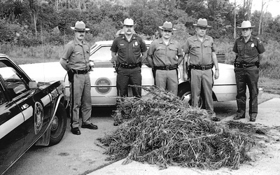 Border Patrol USBP Miscellaneous Historical history old agents pose with state police officers in from of a pile of marijuana