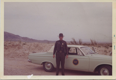 Miscellaneous Historical history old inspector in dress uniform in front of a seafoam green car