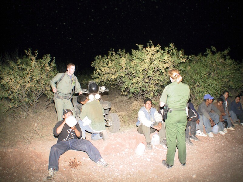 Border Patrol USBP miscellaneous modern agents watch and interview arrested aliens at night