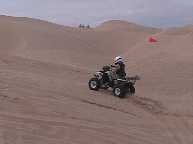 Border Patrol USBP miscellaneous modern ATV agent riding on the sand dunes