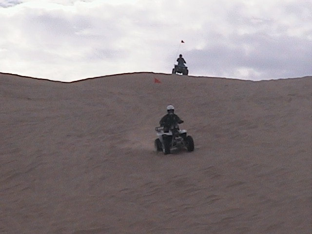 Border Patrol USBP miscellaneous modern ATV agent riding on the sand dunes