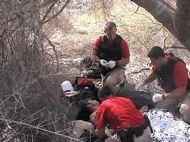 Border Patrol USBP miscellaneous modern BORSTER agents rescuing an alien giving first aid
