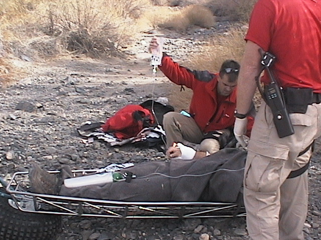 Border Patrol USBP miscellaneous modern BORSTER agents rescuing an alien in a stretcher giving first aid