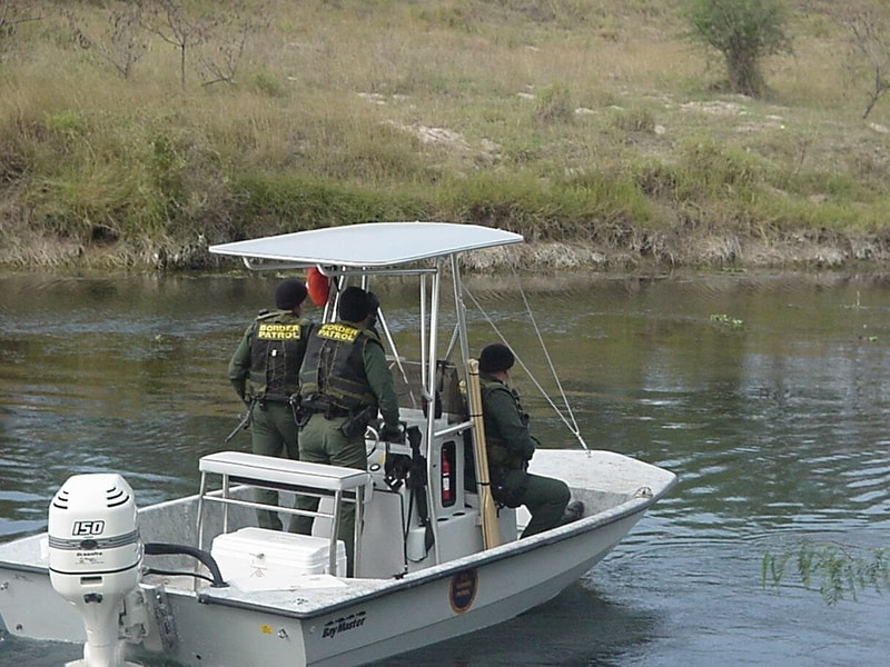 Border Patrol USBP miscellaneous modern  two agents and an arrest alien in a boat