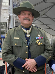 Retired Assistant Chief Eric Gough in uniform wearing the following awards, CBP Medal of Honor for Heroism, USBP Newton-Azrak Award, Department of State Superior Honor Award, Department of the Army Meritorious Public Service Medal, the NATO Non-Article 5 medal for ISAF, the CBP Iraqi Service medal, and the CBP Afghanistan Service Medal