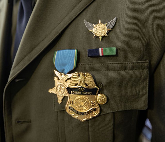 A BORTAC Agent receiving the Newton-Azrak Award while wearing the USBP Achievement Medal ribbon (upside-down)
