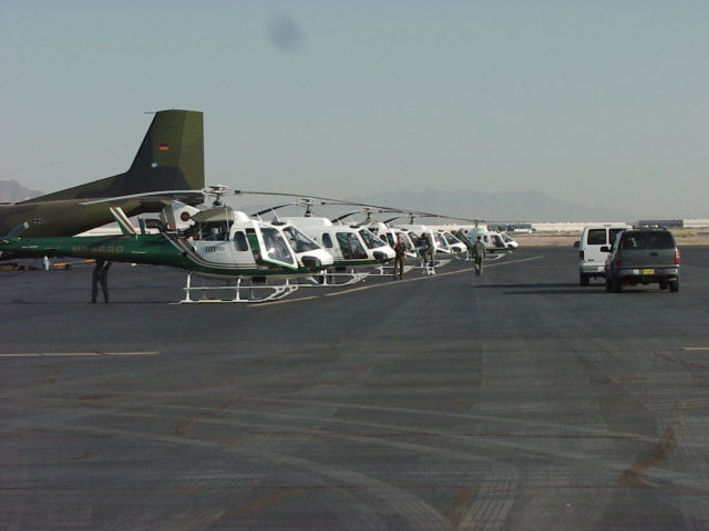 Border Patrol USBP miscellaneous modern helicopters on the ground at the airport