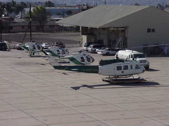 Border Patrol USBP miscellaneous modern helicopters on the ground at the airport
