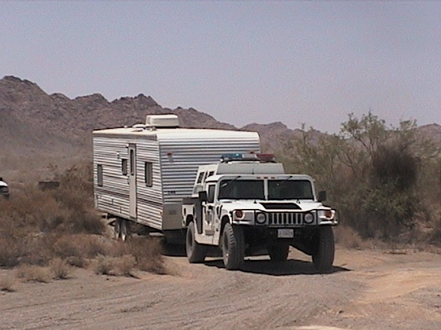Border Patrol USBP miscellaneous modern humvee pulling a trailer in the desert