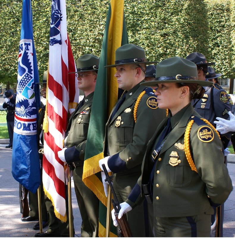 In a steadfast tribute to service and duty, retired Border Patrol Agents Clifford Gill, Richard Hudson, and Maria Ibanez are depicted during their tenure as members of the Honor Guard. This 2006 photograph captures a moment of their commitment as they performed in the Color Guard at a ceremony at the National Law Enforcement Officers Memorial
