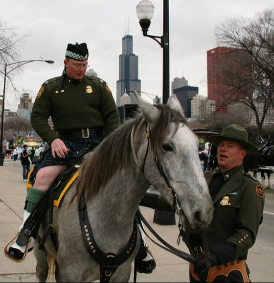 Clifford Gill in a kilt and on a horse, with LeAlan Pinkerton at the 2008 Chicago St. Patrick's Day Parade.