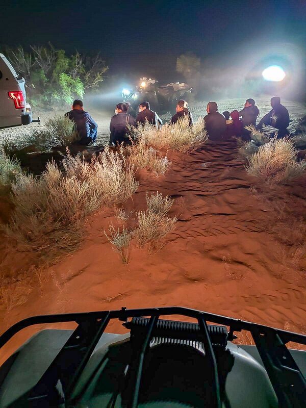 Border Patrol USBP miscellaneous modern agents arresting aliens at night in the desert with flashlights