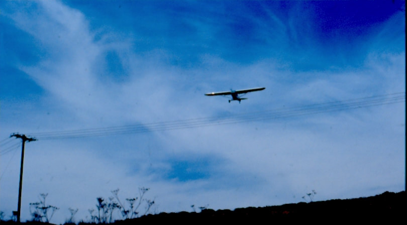 USBP Border Patrol photographs 1970-1990 airplane flying low