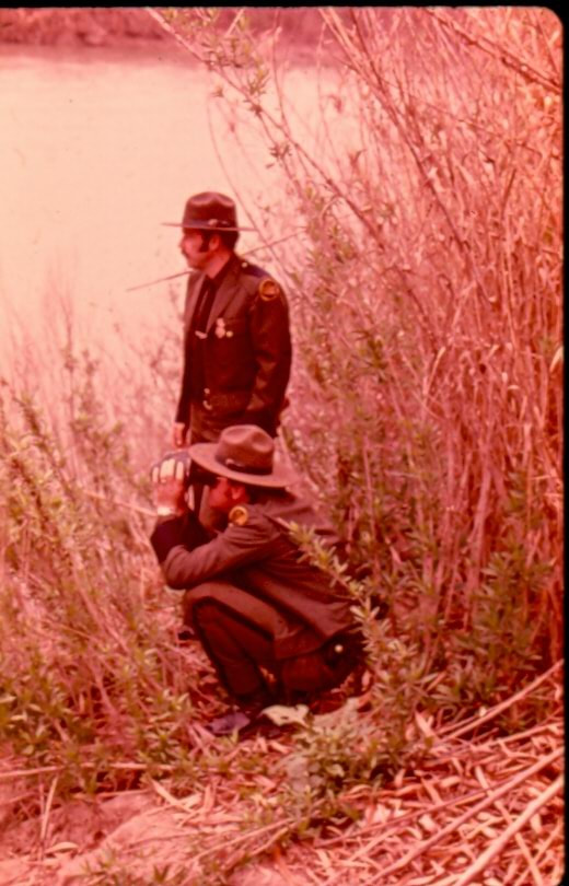 USBP Border Patrol photographs 1970-1990 two agents wearing dress uniforms watching