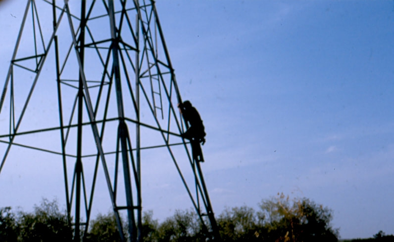 USBP Border Patrol photographs 1970-1990 agent climbing a tower