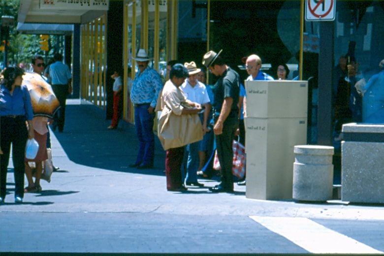 USBP Border Patrol photographs 1970-1990 agent wearing a dress uniform speaking to a person