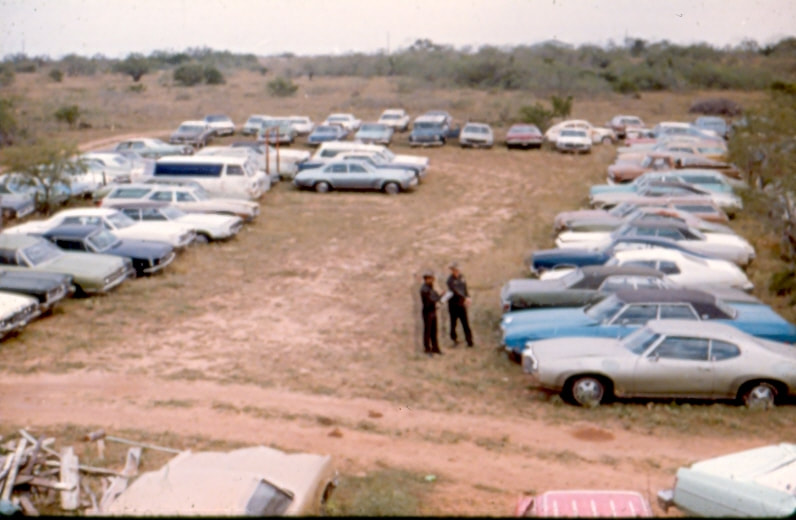 USBP Border Patrol photographs 1970-1990 agent in a dirt parking lot