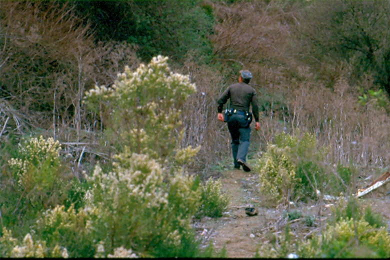 USBP Border Patrol photographs 1970-1990 agent checking a trail