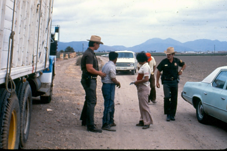 USBP Border Patrol photographs 1970-1990 two agents arresting people