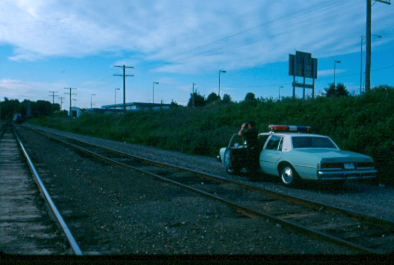 USBP Border Patrol photographs 1970-1990 agent watching train tracks