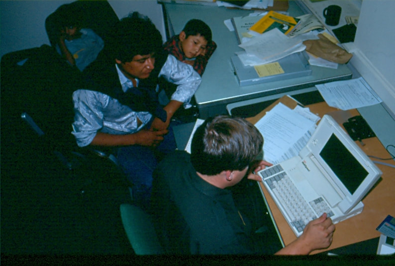 USBP Border Patrol photographs 1970-1990 agent processing aliens at a station