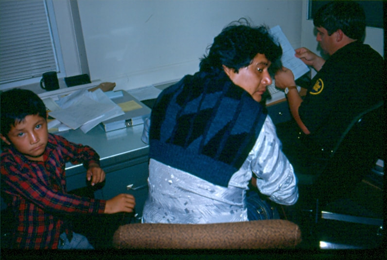 USBP Border Patrol photographs 1970-1990 agent processing an arrested man