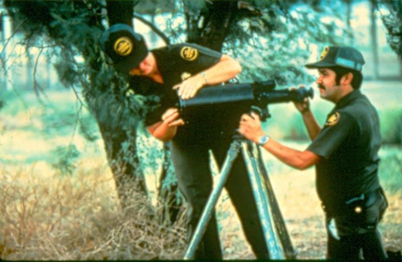 USBP Border Patrol photographs 1970-1990  two agents setting up a large scope
