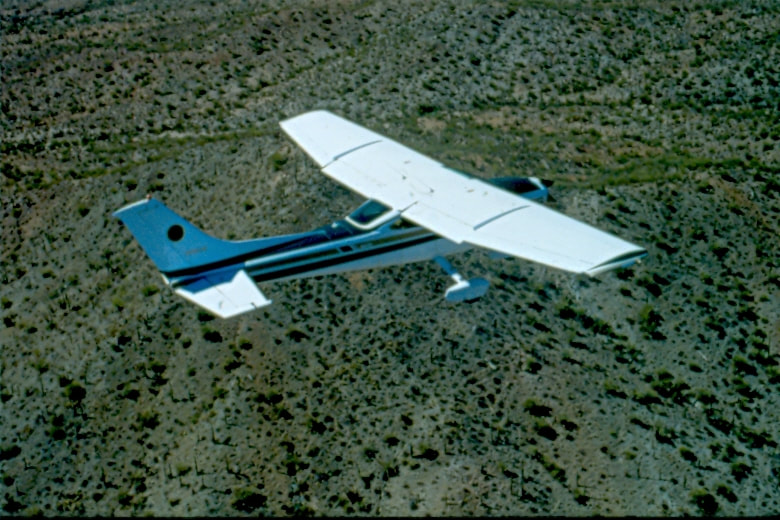 USBP Border Patrol photographs 1970-1990  airplane flying over the desert