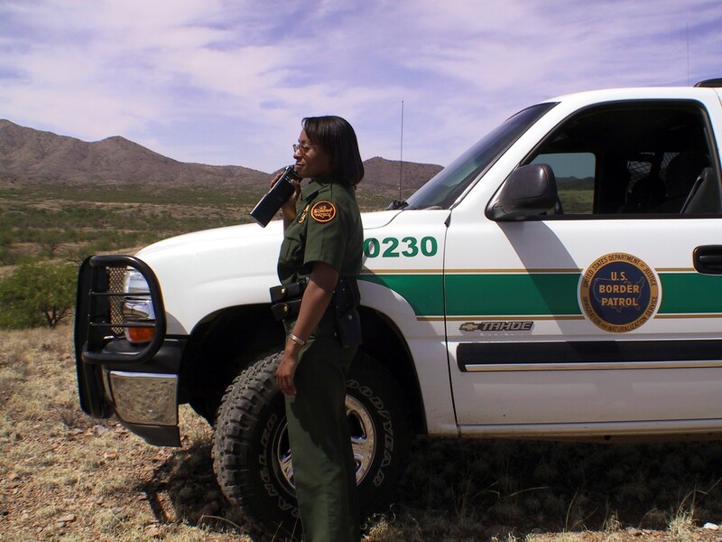 Border Patrol USBP miscellaneous modern female agent by a vehicle
