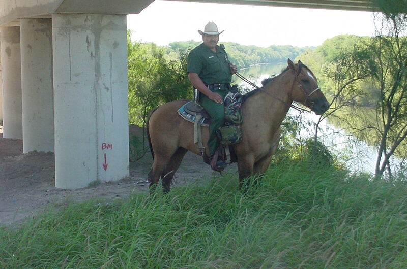 Border Patrol USBP miscellaneous modern horse patrol agent under a bridge near the river
