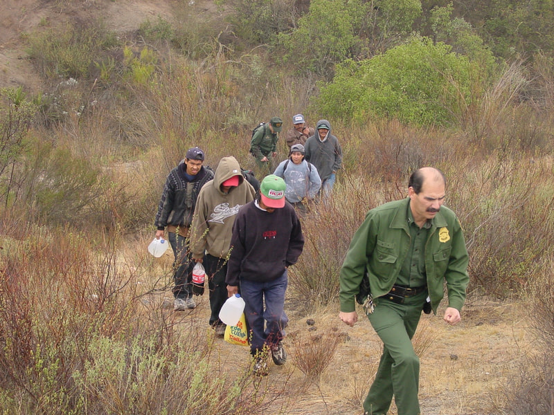 Border Patrol USBP miscellaneous modern agents walking aliens out of the field